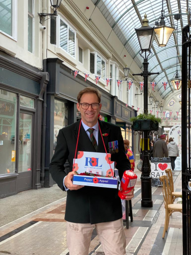 Tobias Ellwood MP selling poppies in Bournemouth's Arcade